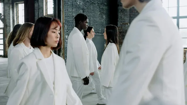 EU digital product passport regulation, diverse models in white suits walking indoors with natural light