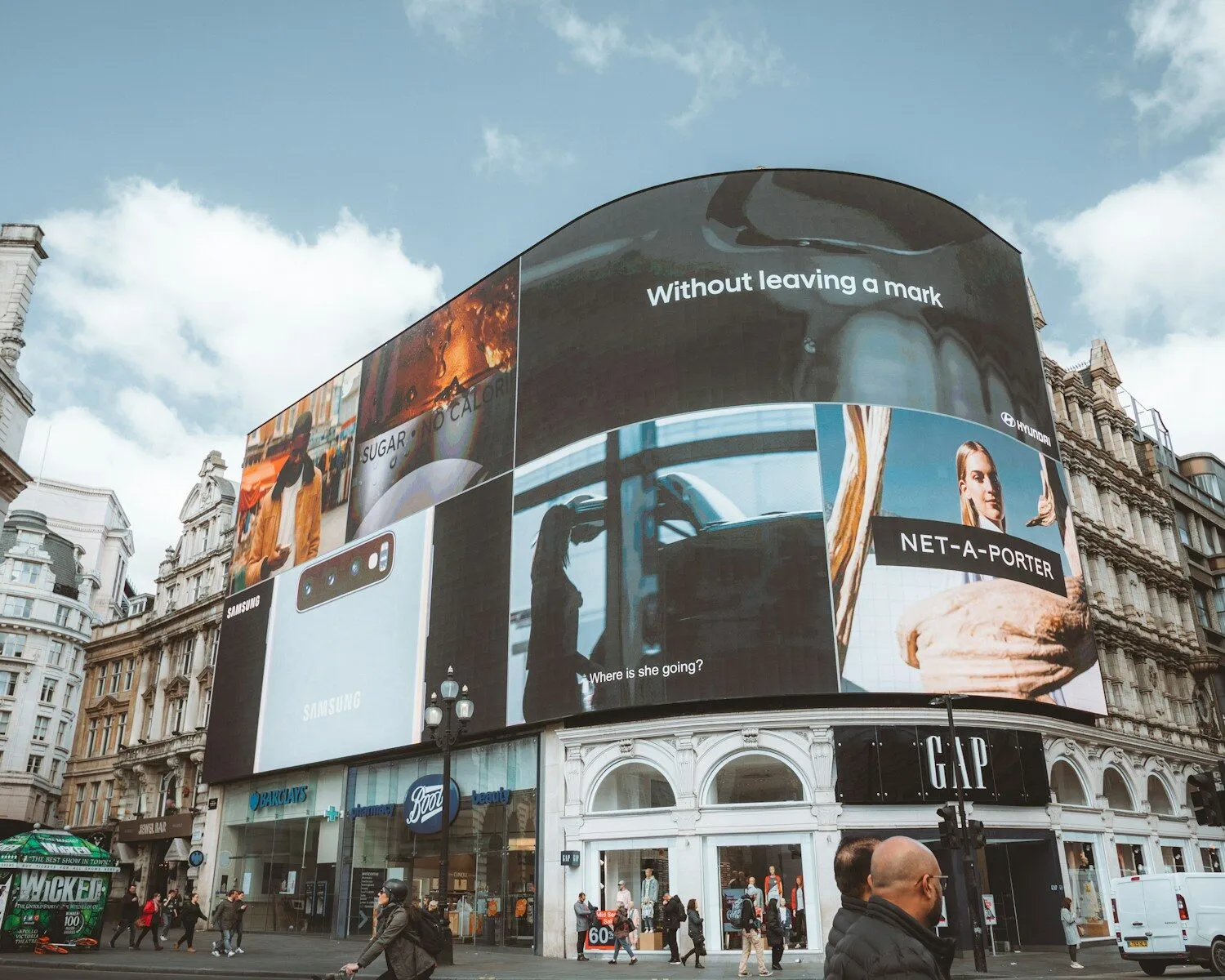 Digital billboards representing how a DPP can be used as a marketing tool for fashion brands